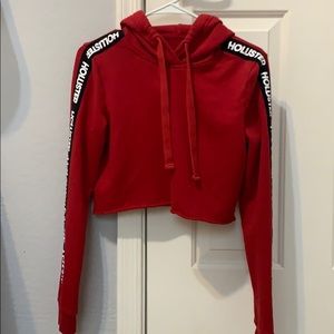 This is a cropped red hoodie.